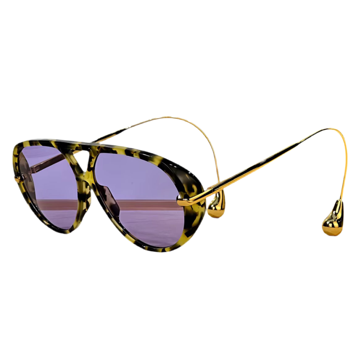 Moderne Sonnenbrille im Statement-Design mit tropfenförmigen Endstücken an goldenen oder silbernen Metallbügeln. Erhältlich in Schwarz, Blau, Braun, Gelb und Schildpatt – stilvoll, auffällig und hochwertig.