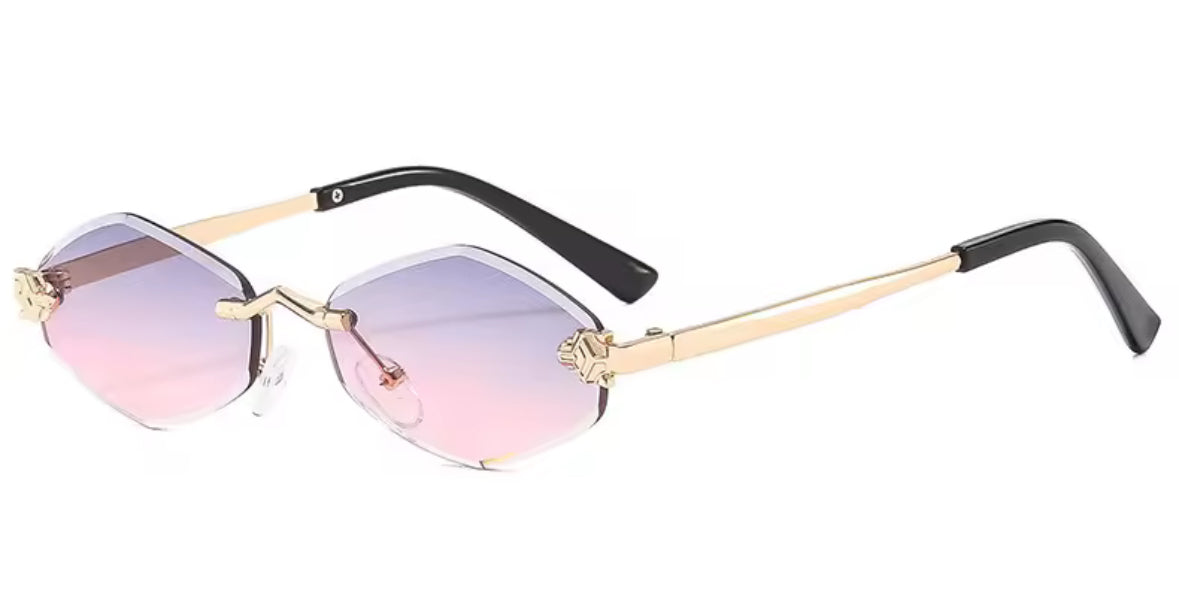 Randlose Sonnenbrille mit goldenen Panther-Details an den Gläsern, erhältlich in fünf Farbvarianten mit schwarzen Bügeln